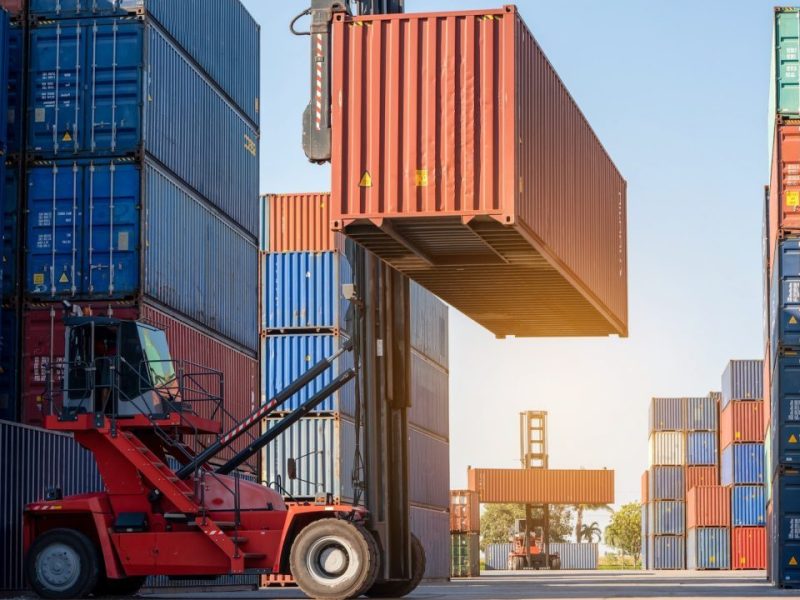 forklift-working-in-the-container-cargo-yard-port-loading-cargo-tank-logistic-service-and-transport-e1665466492906