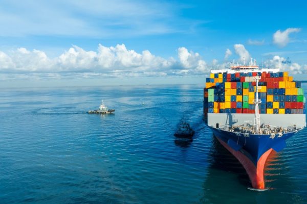 front-view-contaier-cargo-ship-import-export-container-box-on-the-ocean-sea-on-blue-sky.jpg